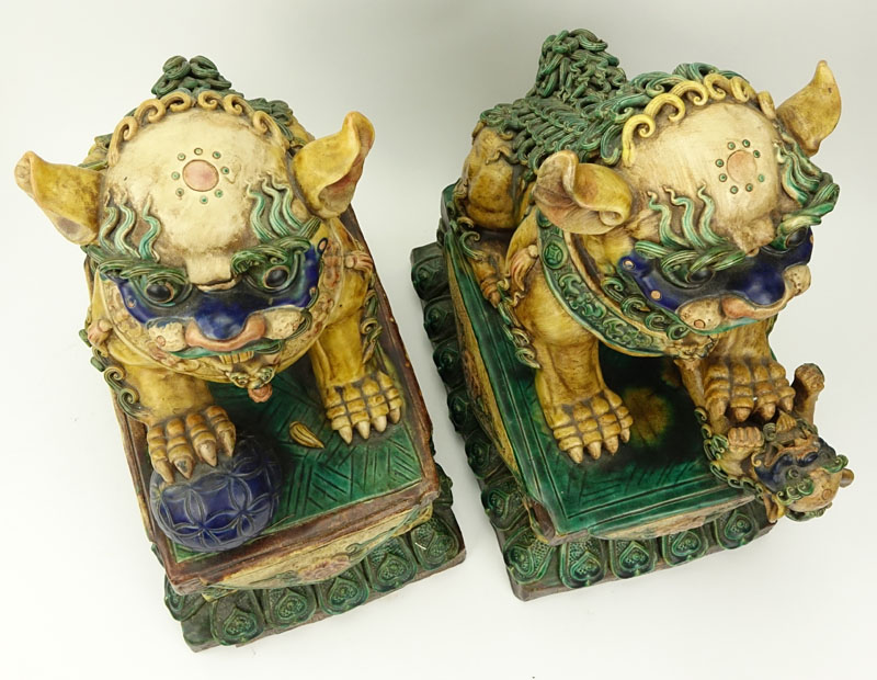 Pair of Large Chinese Polychrome Pottery Foo Dogs.