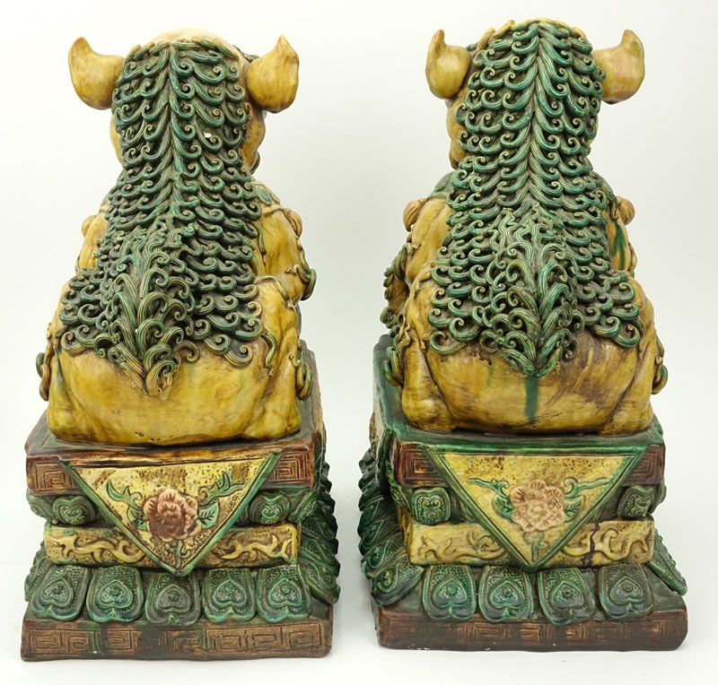 Pair of Large Chinese Polychrome Pottery Foo Dogs.