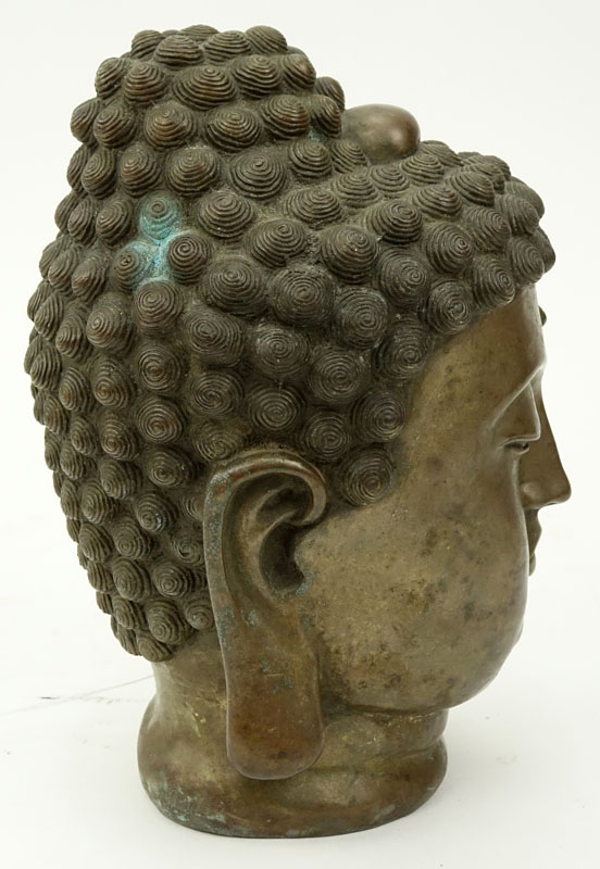 19/20th Tibetan Bronze Shakyamuni Buddha Head. Rubbing to gilt.