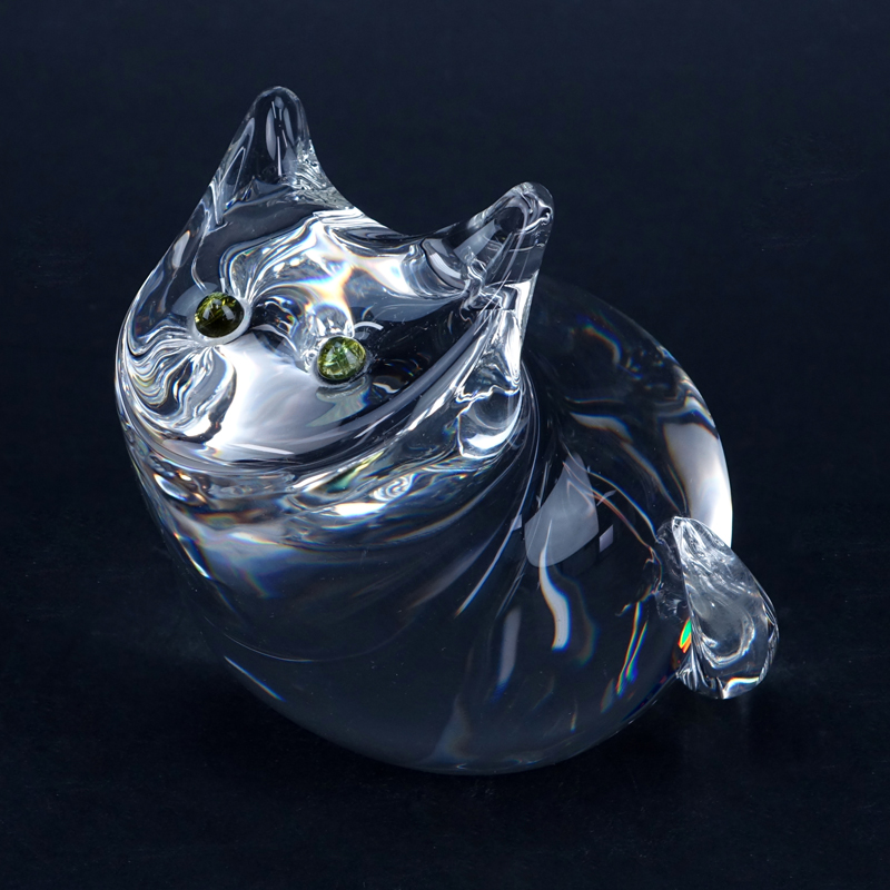 Steuben Crystal Cat Figurine with Green Tourmaline Eyes. Signed. Normal scuffing on underside otherwise good condition. Measures 4-1/2" H. Shipping $42.00 (estimate $100-$200)