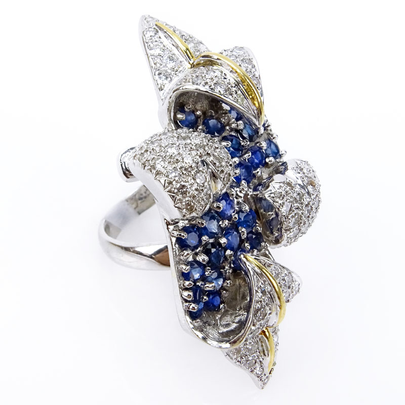 Retro Design Approx. 2.5 Carat Pave Set Round Brilliant Diamond, 3.0 Carat Pave Set Oval Cut Sapphire and Heavy 18 Karat White and Yellow Gold Cocktail Ring. 