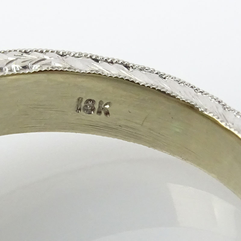 Fine Quality Approx. 12.02 Carat Colombian Emerald, 1.10 Carat Baguette Cut Diamond and 18 Karat Gold Ring. 