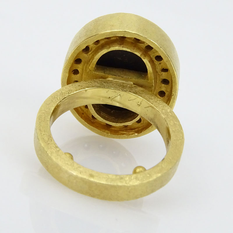 Approx. 10.0 Carat Oval Cut Black Diamond and 18 Karat Yellow Gold Ring with Diamond Bezel.