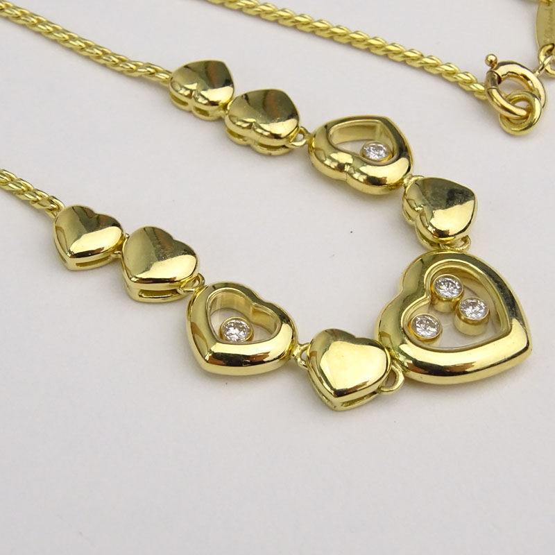 Vintage Chopard Happy Diamond and 18 Karat Yellow Gold Multi Hearts Charm Necklace.