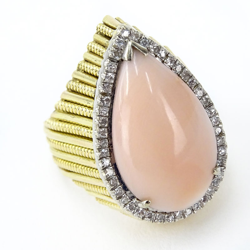 Vintage Circa 1960s Approx. 4.0 Carat Pear Shape Angel Skin Pink Coral, .42 Carat Single Cut Diamond and 14 Karat Yellow Gold Ring. 