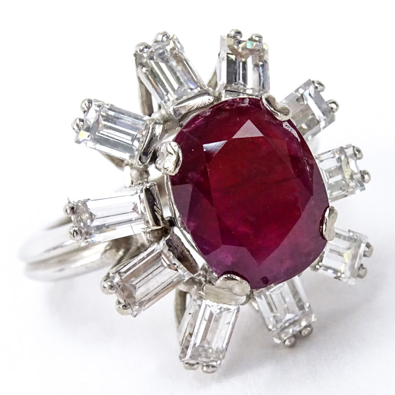 Vintage Oval Cut Ruby, Approx. 2.0 Carat Emerald Cut Diamond and Platinum Ring. 