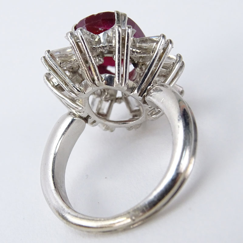 Vintage Oval Cut Ruby, Approx. 2.0 Carat Emerald Cut Diamond and Platinum Ring. 