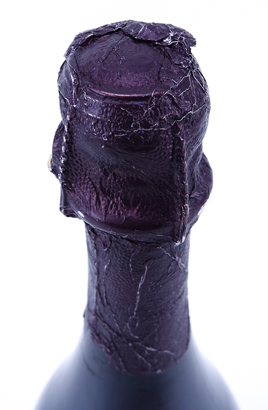 Vintage 2003 Dom Pérignon Rosé Champagne Bottle with Luminous Label. In unopened condition.