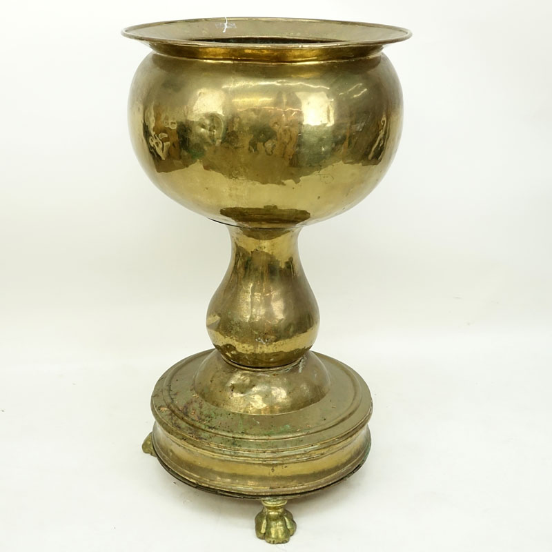 Large Brass Jardinière with Paw Feet. Has a few dings and dents, needs cleaning. 