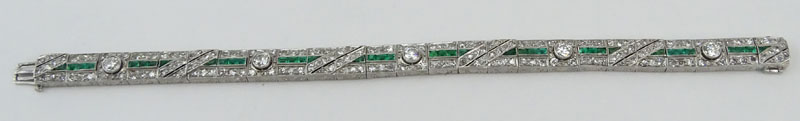 Circa 1920s Art Deco Approx. 5.50 Carat Diamond, 2.0 Carat Emerald and Platinum Bracelet. 