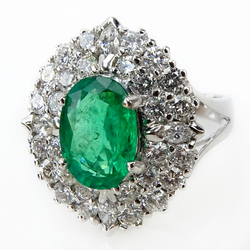 Approx. 2.16 Carat Oval Cut Emerald, 1.76 Carat TW Diamond and 18 Karat White Gold Ring. 