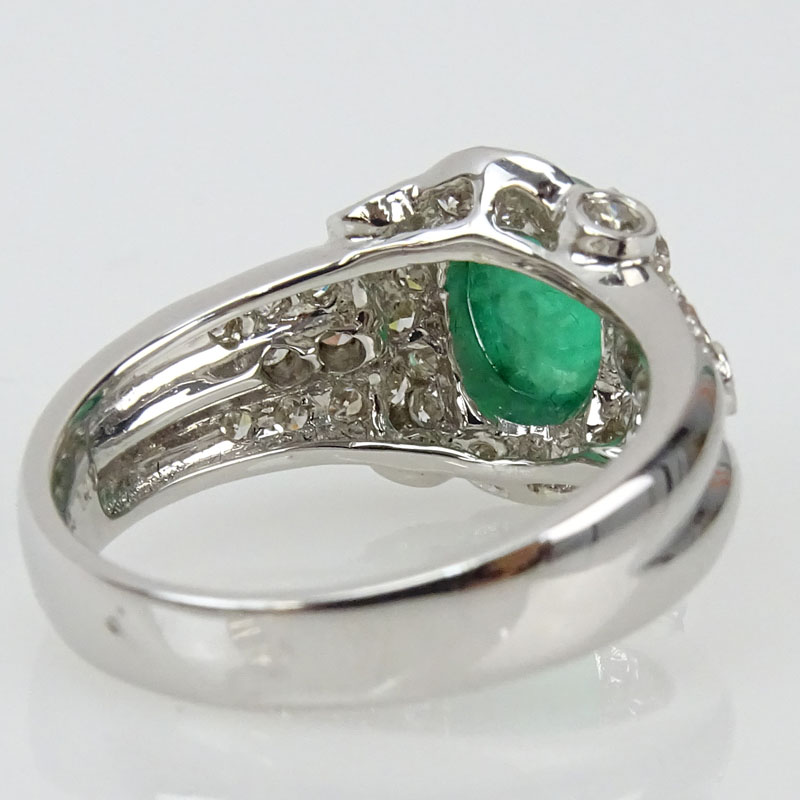 Approx. 1.43 Carat Cabochon Emerald, .64 Carat Diamond and 18 Karat White Gold Ring. 