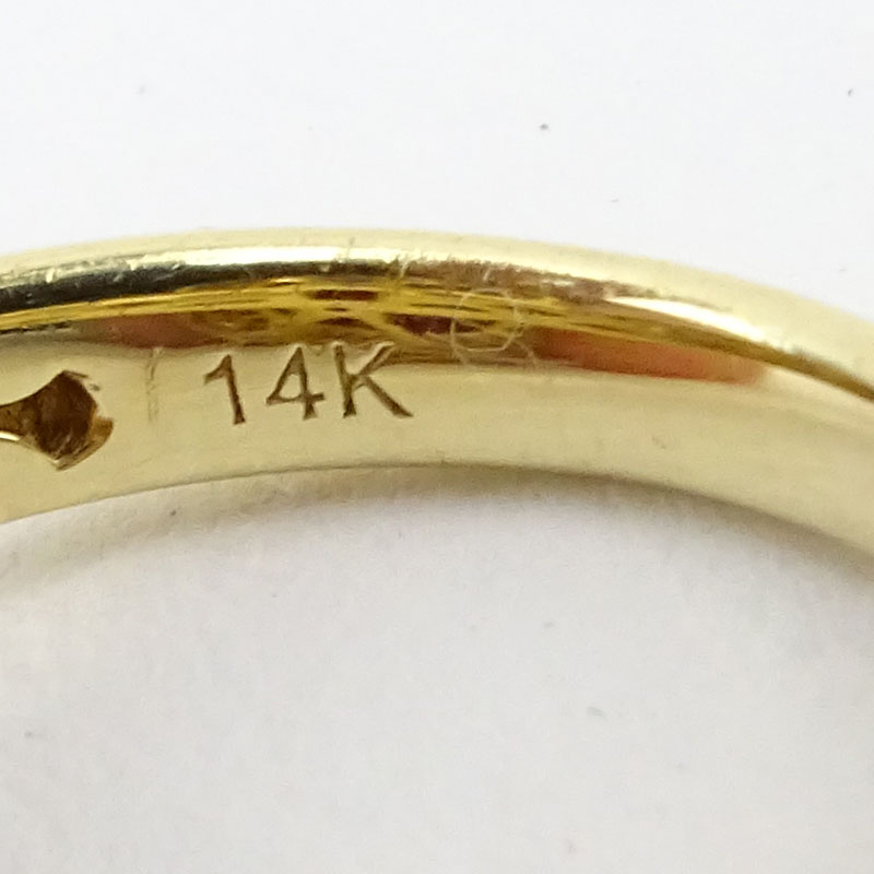 Approx. 11.50 Carat Cabochon Burma Ruby, 2.03 Carat Diamond and 14 Karat Yellow Gold Ring. 