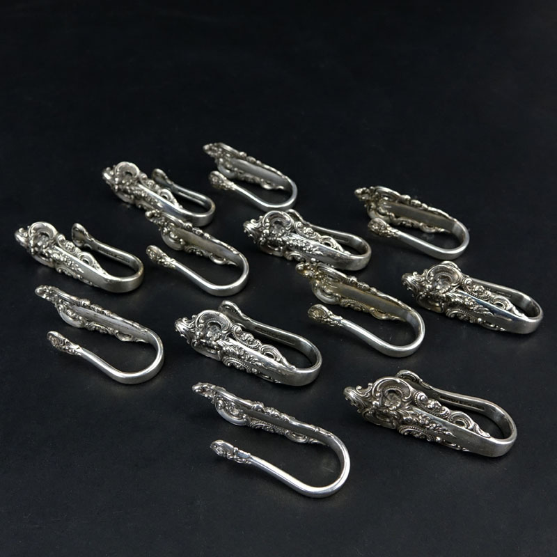 Set of Twelve (12) Wallace "Grand Baroque" Sterling Silver Napkin Clips. 