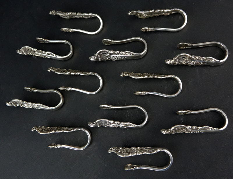 Set of Twelve (12) Wallace "Grand Baroque" Sterling Silver Napkin Clips. 