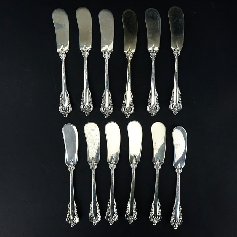 Set of Twelve (12) Wallace "Grand Baroque" Sterling Silver Butter Spreaders. 