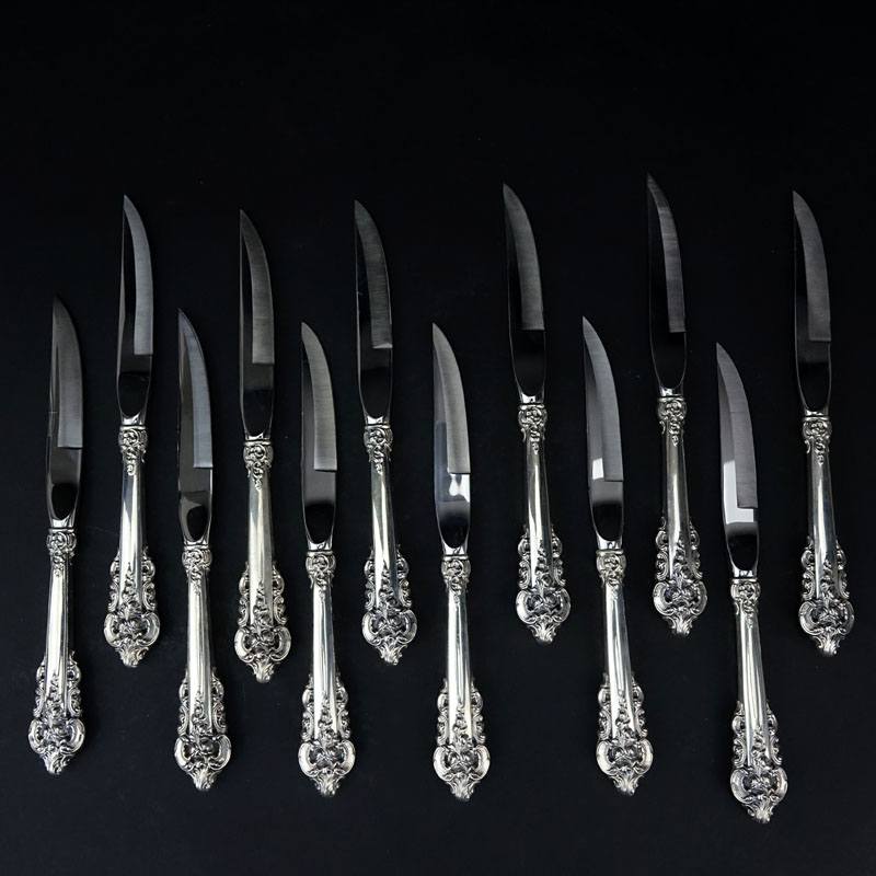 Set of Twelve (12) Wallace "Grand Baroque" Sterling Silver Handled Beveled Steak Knives.