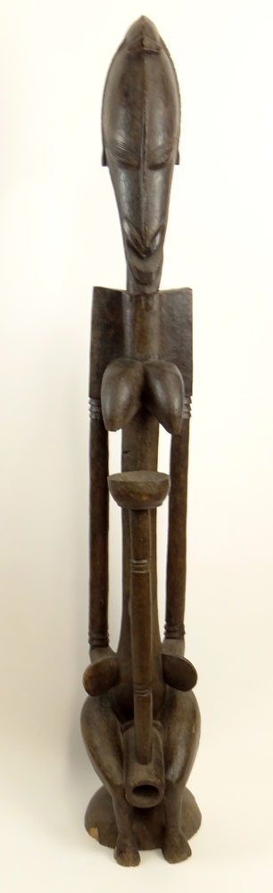 Large African Carved Wood Sculpture of a Seated Woman.