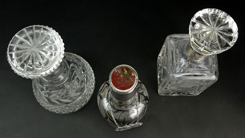 Grouping of Three (3) Decanters. Includes: two etched crystal and one overlay decanter.