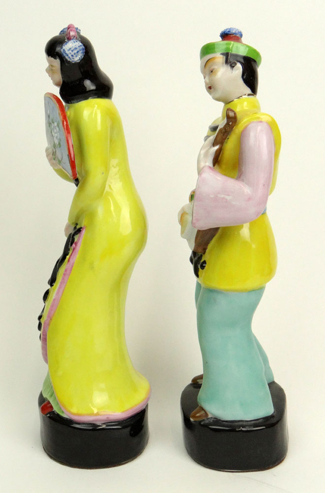 Pair of Retro Chinese Hollywood Regency Style Porcelain Figural Groups of Young Girl with Fan and Young Boy with Instrument.