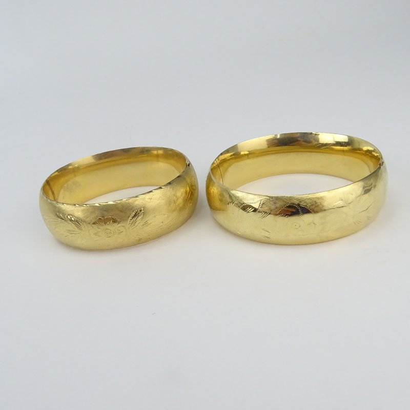 Pair of Antique Engraved 14 Karat Yellow Gold Wide Hinged Bangle Bracelets.