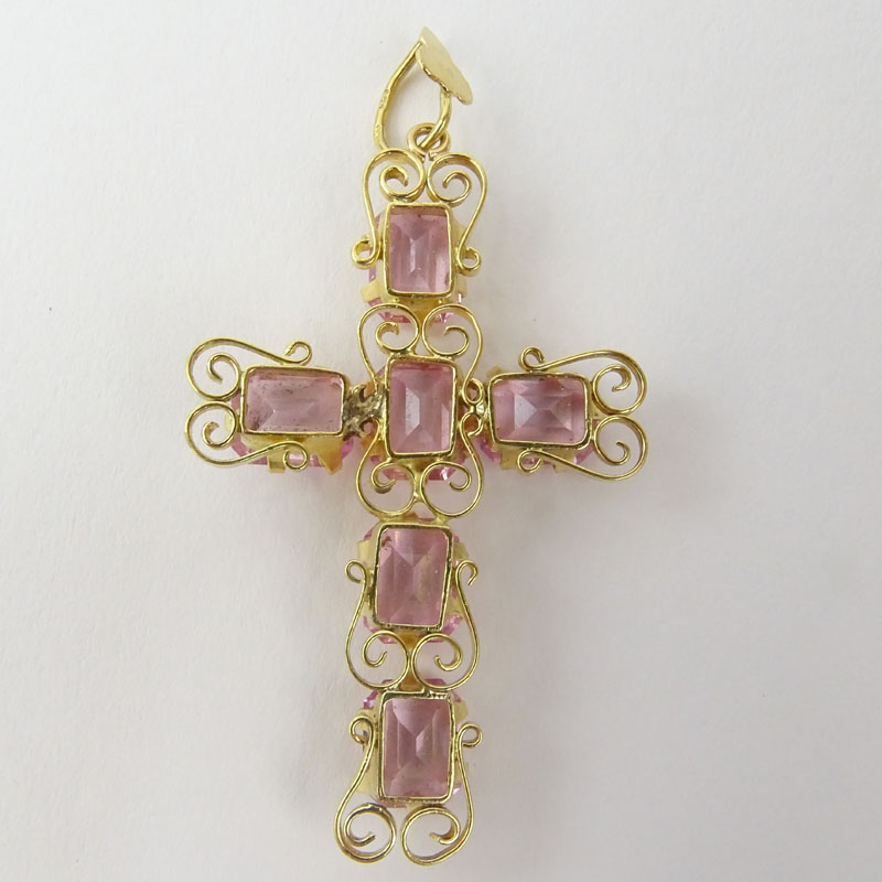 18 Karat Yellow Gold and Pink Stone Cross Pendant. Stamped 18K.