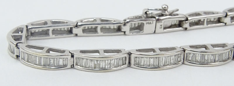 Vintage Approx. 3.0-3.5 Carat Baguette Cut Diamond and 14 Karat White Gold Bracelet and Earring Suite.