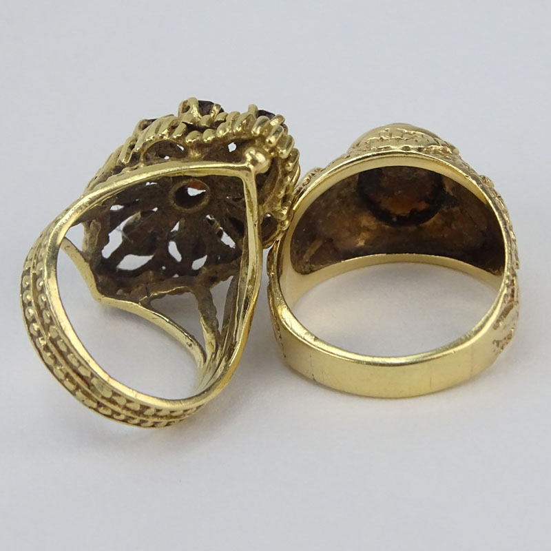 Vintage 14 Karat Yellow Gold and Cat's Eye together with a Vintage Garnet and 14 Karat Yellow Gold Cluster Ring.