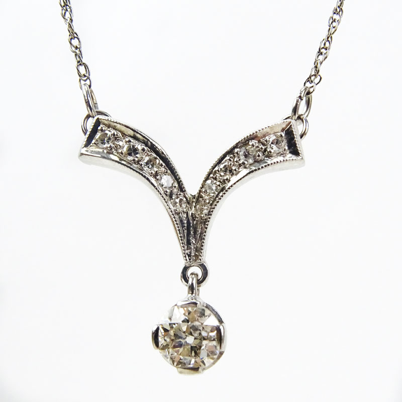 Vintage Diamond and 14 Karat White Gold Pendant Necklace set with a .67 Carat Old European Cut Diamond.