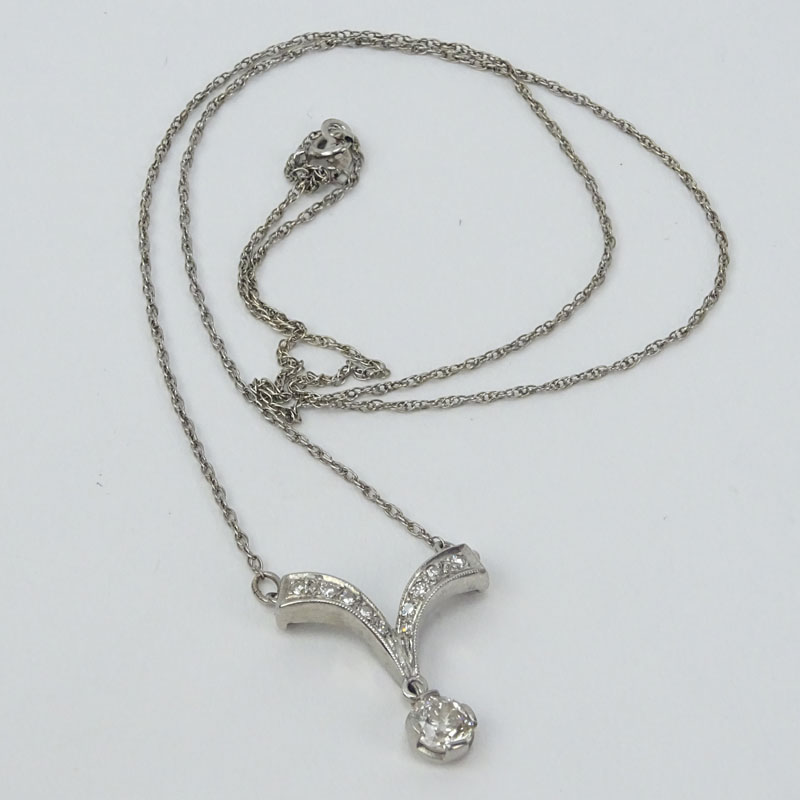 Vintage Diamond and 14 Karat White Gold Pendant Necklace set with a .67 Carat Old European Cut Diamond.