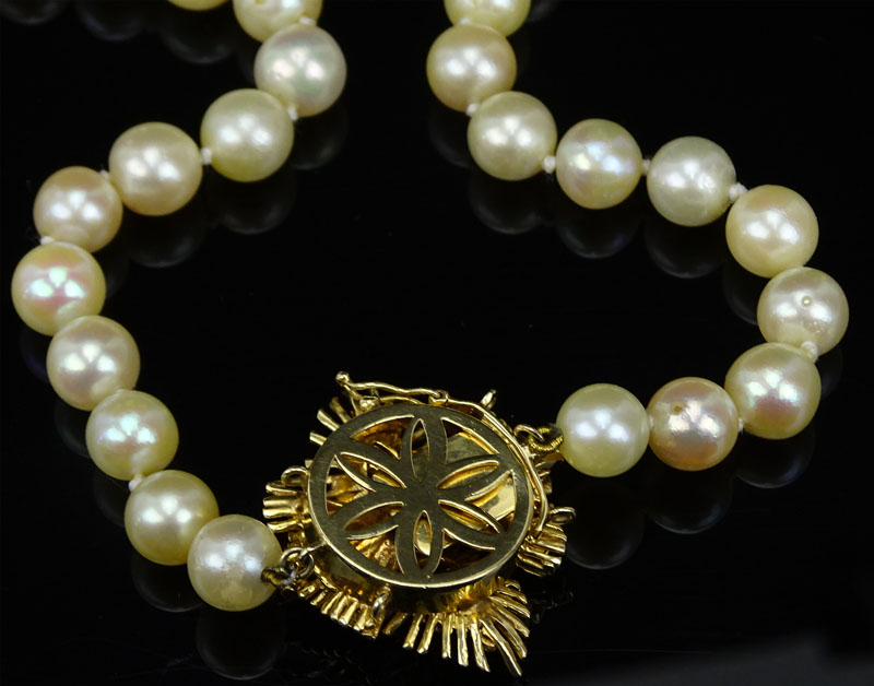 Vintage Single Strand White Pearl Necklace with 14 Karat Yellow Gold Clasp accented with Diamonds and Rubies.