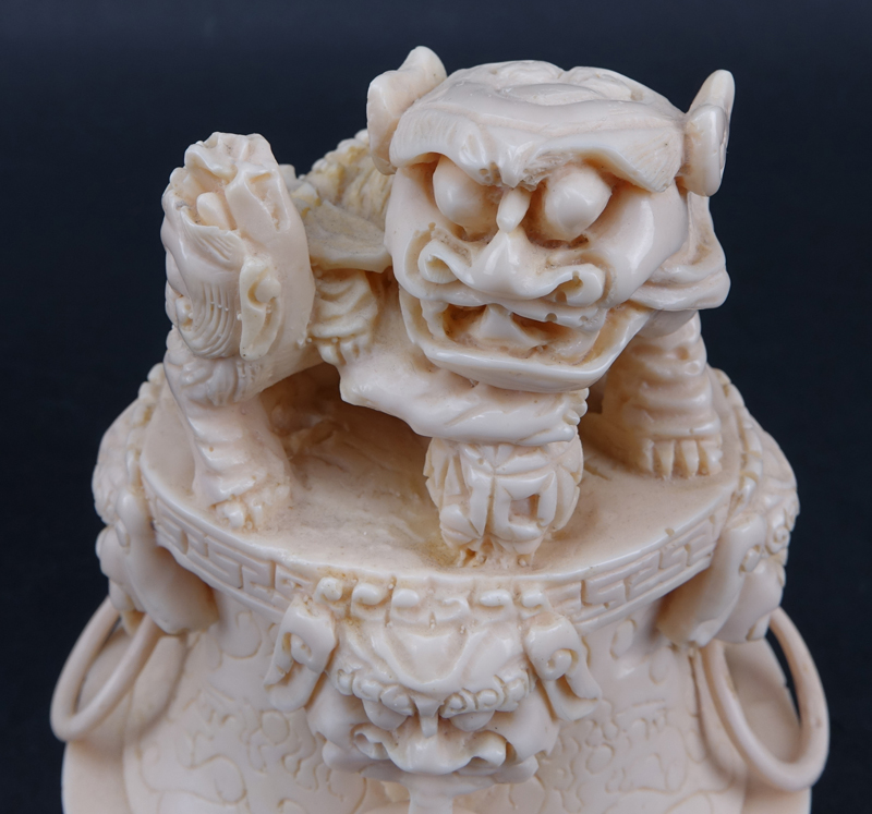 Vintage Faux Ivory Lidded Vessel. Features dragon ring handles, foo dog finial. 
