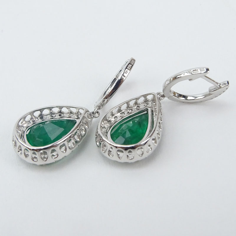 Approx. 6.59 Carat Pear Shape Colombian Emerald, 1.0 Carat Round Brilliant Cut Diamond and 18 Karat White Gold Earrings. .