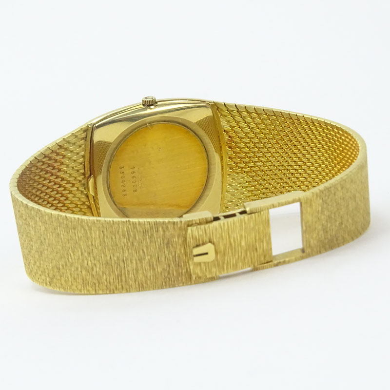 Man's Vintage Universal Geneve 18 Karat Yellow Gold Golden Shadow Bracelet Watch with Automatic Movement.
