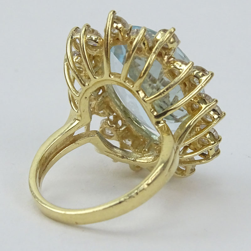 Vintage Approx. 13.70 Carat Oval Cut Aquamarine, 2.25 Carat Round Brilliant Cut Diamond and 14 Karat Yellow Gold Ring. 