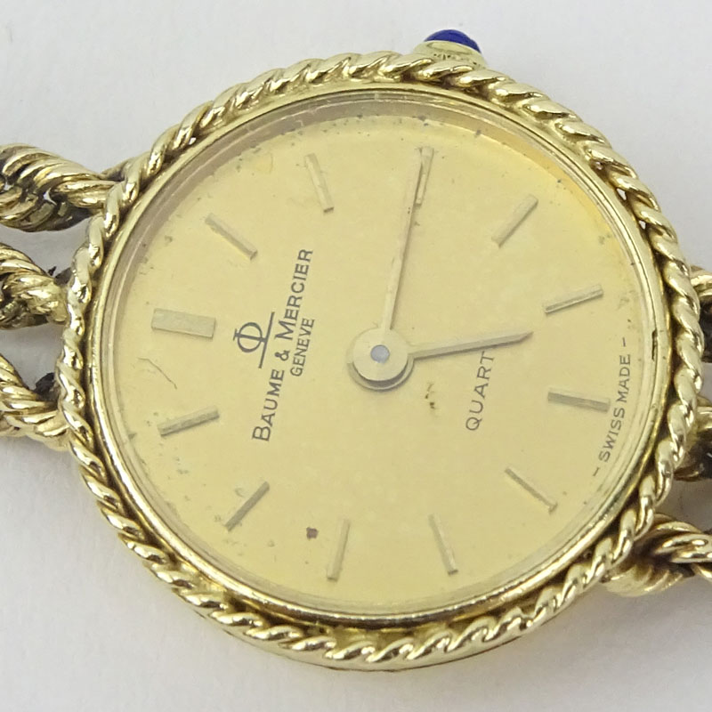 Lady's Vintage Baume & Mercier Genève 14 Karat Yellow Gold Bracelet Watch with Swiss Quartz Movement.