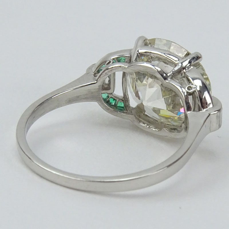GIA Certified Art Deco 6.19 Carat Old European Cut Diamond and Platinum Engagement Ring with Emerald and Diamond Accents.