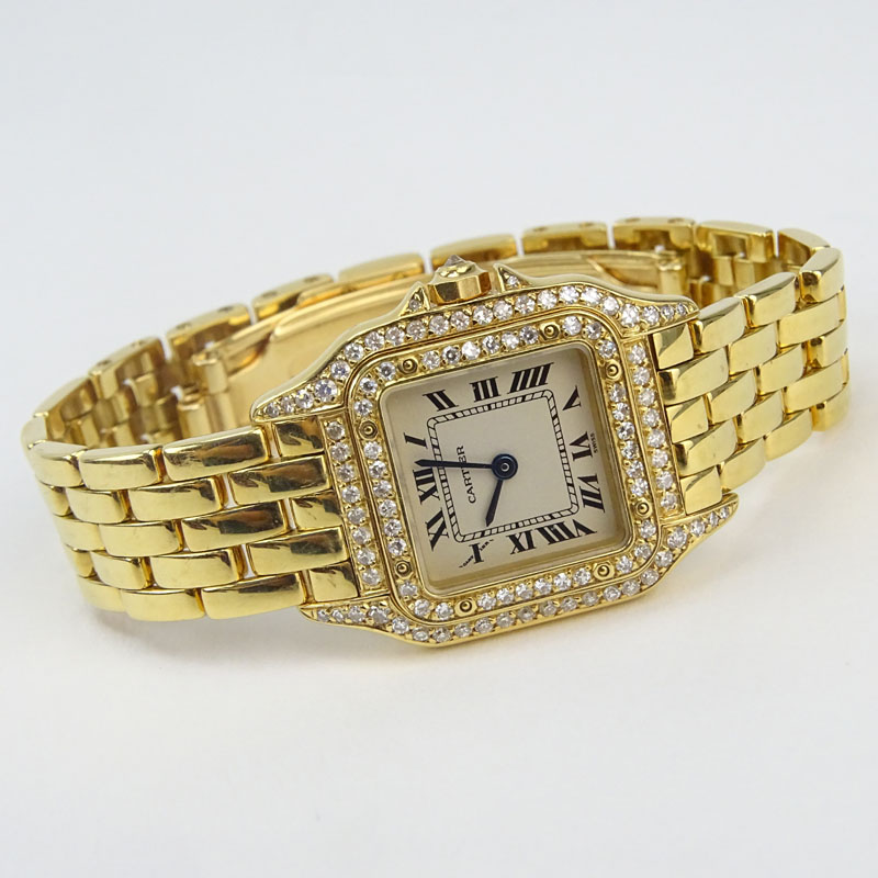 Lady's Cartier 18 Karat Yellow Gold and Diamond Panther Bracelet Watch with Swiss Quartz Movement, Box, Papers and Extra Bracelet Links. 