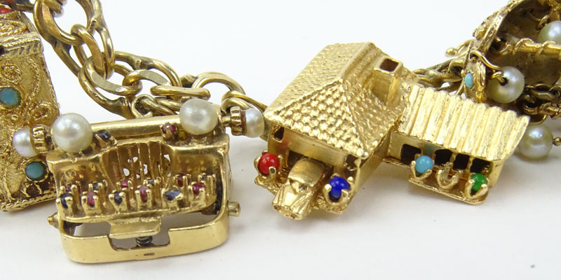 Vintage Heavy 14 Karat Yellow Gold Charm Bracelet with Seven (7) Charms.