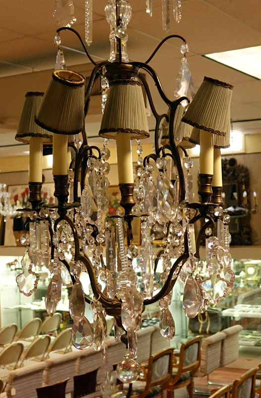 Mid Century Crystal and Brass Eight Light Chandelier with hanging Prism.