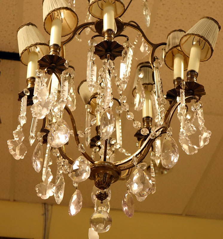 Mid Century Crystal and Brass Eight Light Chandelier with hanging Prism.