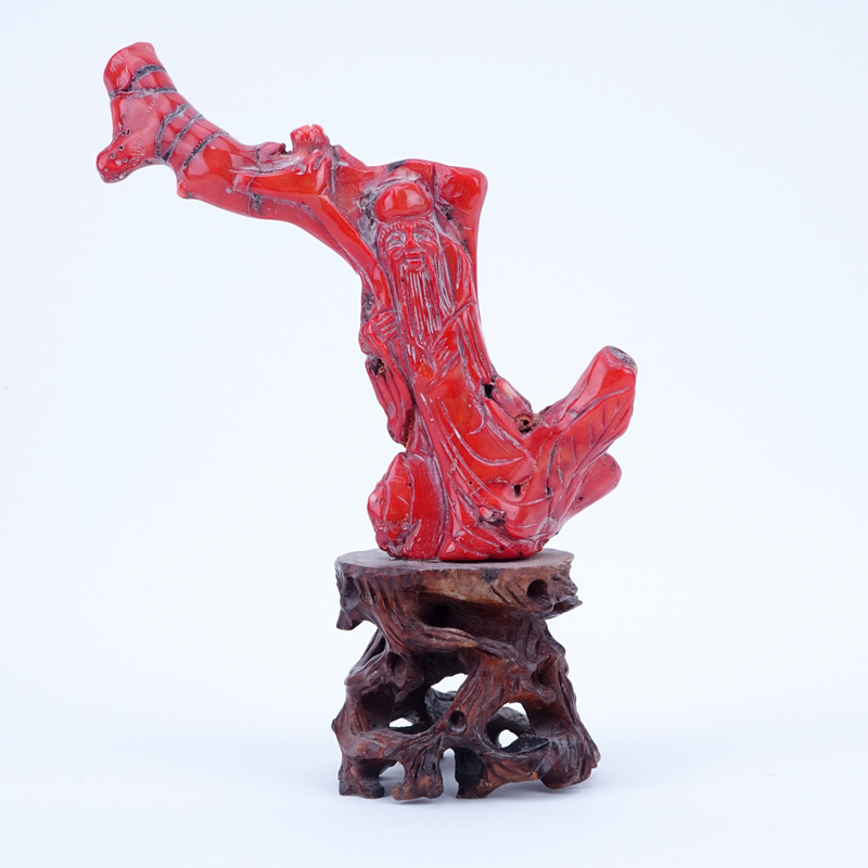 Antique Chinese Red Coral Buddha Carving Mounted on Wooden Stand.