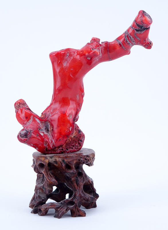 Antique Chinese Red Coral Buddha Carving Mounted on Wooden Stand.