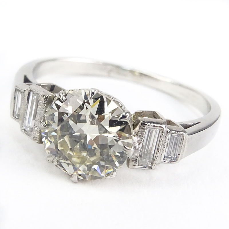 Art Deco Approx. 2.20 Carat Round Brilliant Cut Diamond and Platinum Engagement Ring accented with approx. .30 Carat Baguette Diamonds.