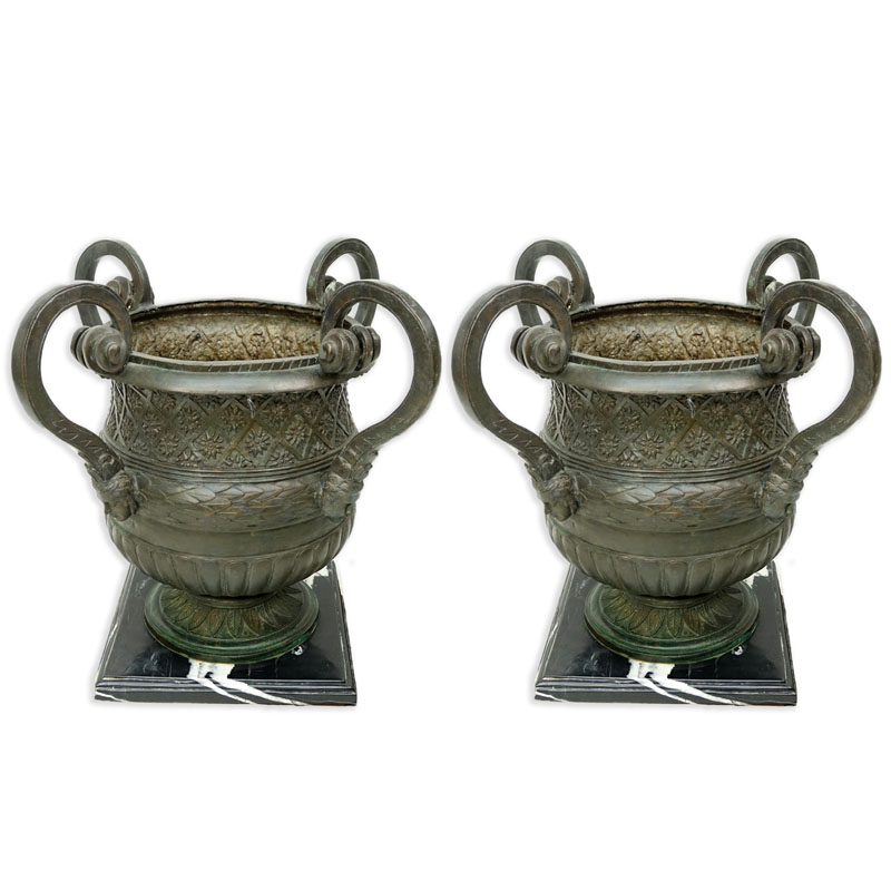 Pair of Large Bronze Figural Handled Garden Urns On Marble Bases.