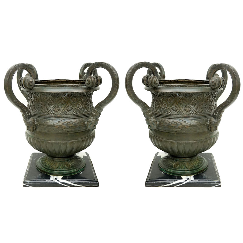 Pair of Large Bronze Figural Handled Garden Urns On Marble Bases.
