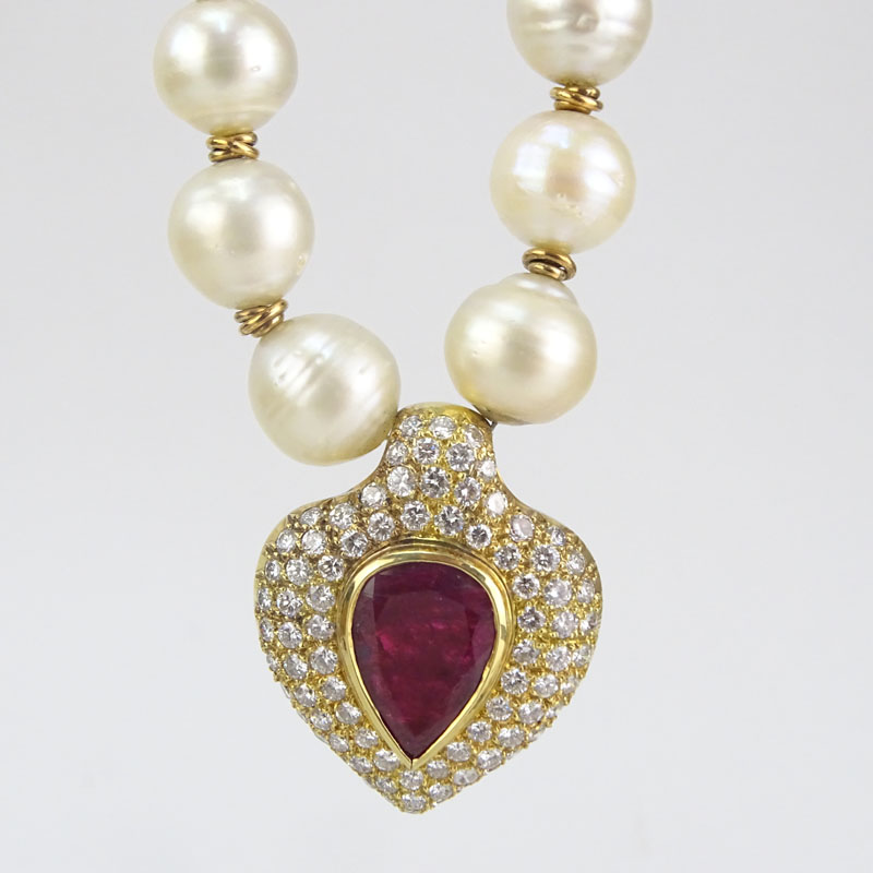 Vintage Large Pear Shape Burma Ruby, Approx. 8.0-8.5 Carat Round Brilliant Cut Diamond, Baroque Pearl and 18 Karat Yellow Gold Pendant Necklace. 