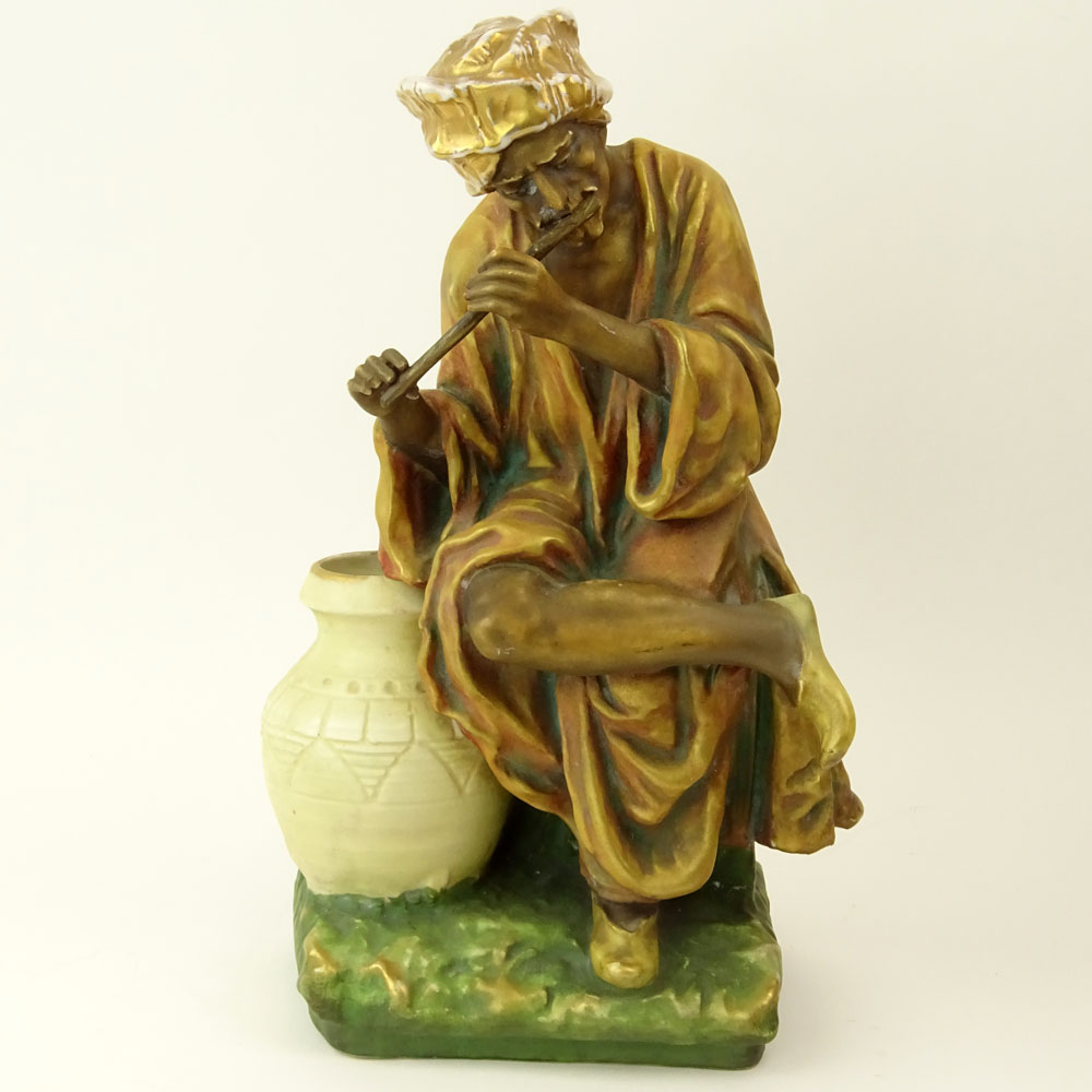 Early 20th Century Austrian Amphora Porcelain Figure, Arab Man Playing Flute.