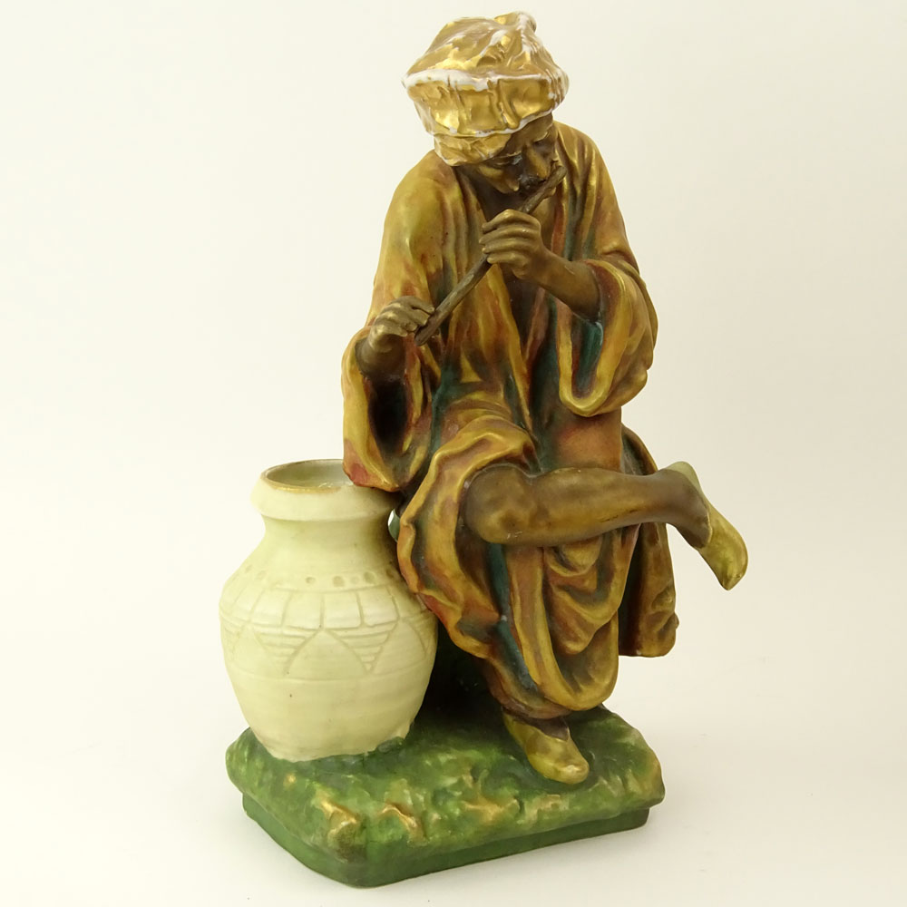 Early 20th Century Austrian Amphora Porcelain Figure, Arab Man Playing Flute.