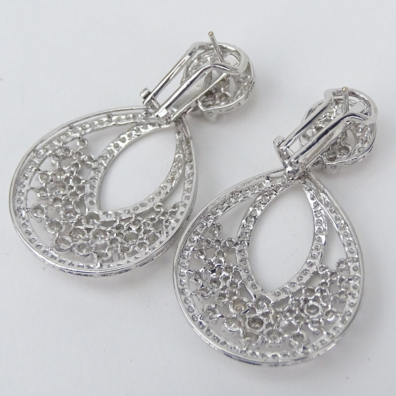 Van Cleef & Arpels style Approx. 7.24 Carat Round Brilliant Cut Diamond and 18 Karat White Gold Chandelier earrings.